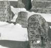 In winter scenery. (Right) "Here lies the important Reb Moshe Nathan son of Reb Ezra(?). He died 12th Tamuz 5677. (Back right) "Here lies the important Reb Avraham son of Reuben..."

Translated by Heidi M. Szpek, Ph.D.