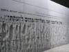 Death Camp memorial with biblical verse Job 16:18 in Polish, English and Hebrew